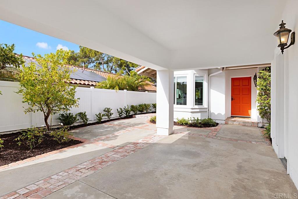 4710 Galicia Way Oceanside, CA 92056 - Photo 3 of 46 a view of a house with a yard and potted plants