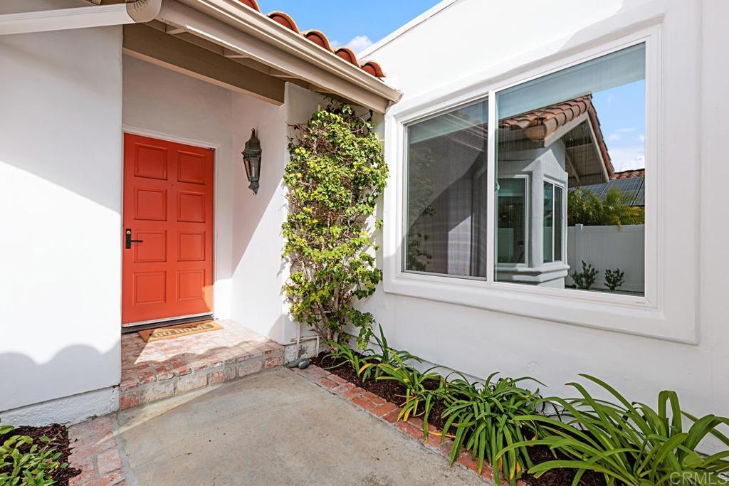 4710 Galicia Way Oceanside, CA 92056 - Photo 4 of 46 front view of a house with a yard