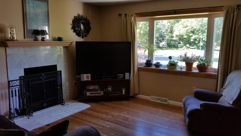 113 Somers Road Hampden, MA 01036 - Photo 8 of 25 a living room with furniture and a fireplace
