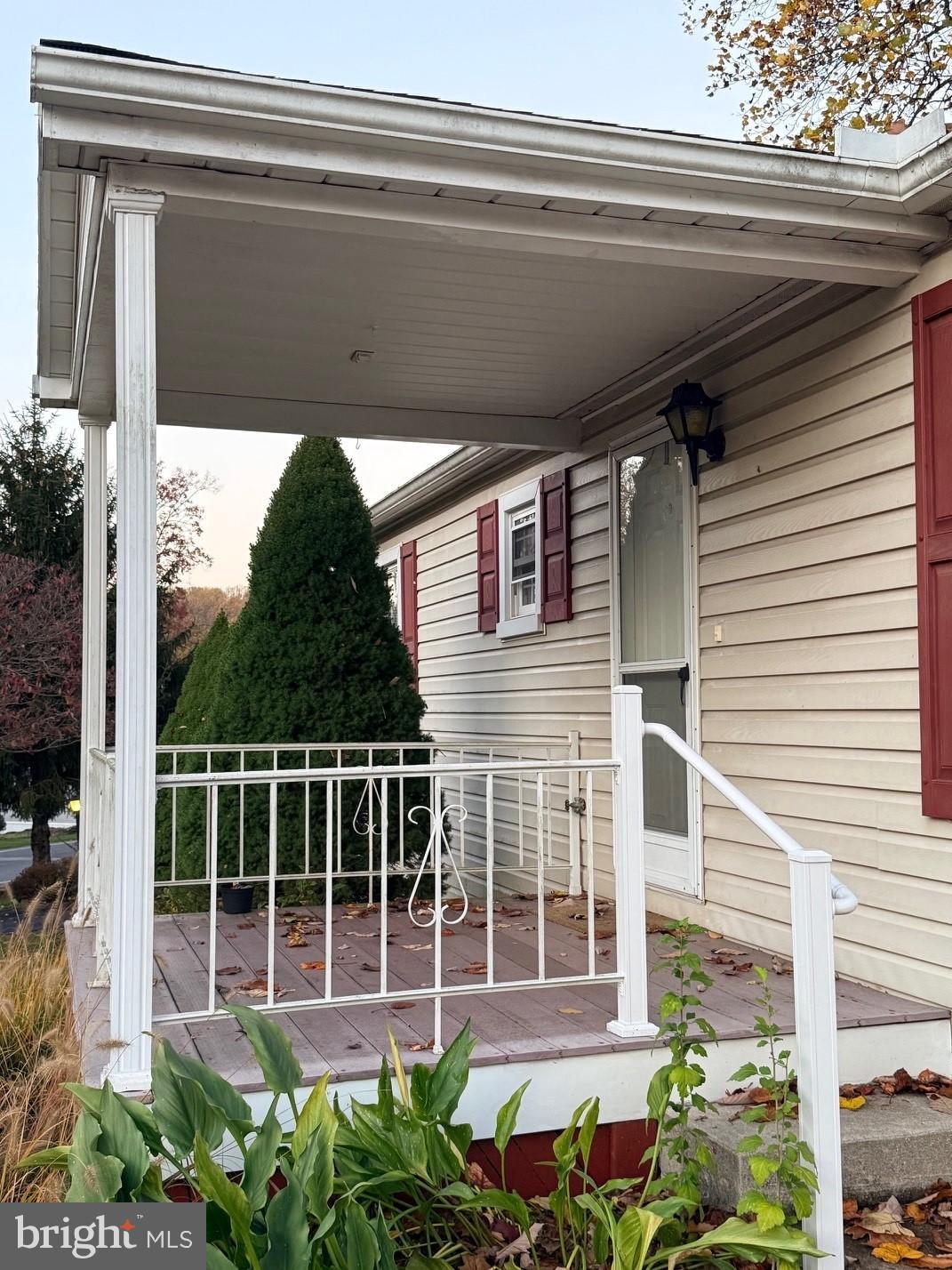 303 Maple Avenue Manheim, PA 17545 - Photo 2 of 19 a view of a house with a large window and potted plants
