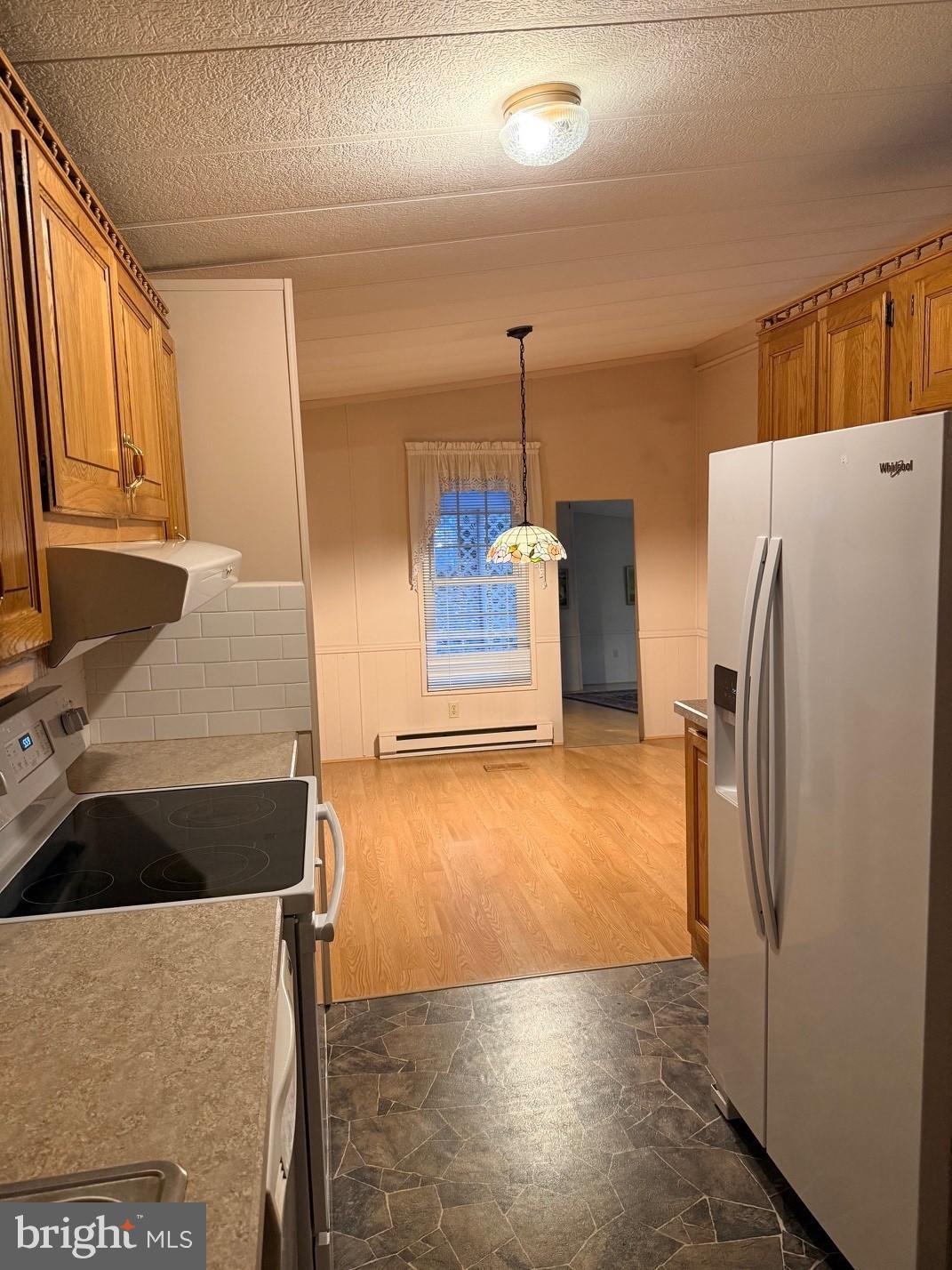 303 Maple Avenue Manheim, PA 17545 - Photo 5 of 19 a kitchen with refrigerator and window