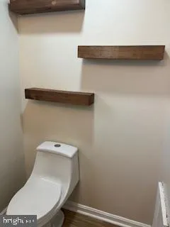 a bathroom with a toilet and a sink