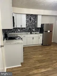 a kitchen with a sink and cabinets