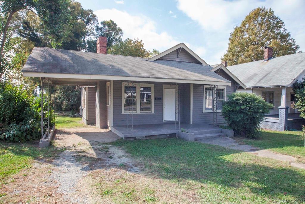 3101 Tuckaseegee Road Charlotte, NC 28208 - Photo 1 of 13 a view of a house with a yard and potted plants