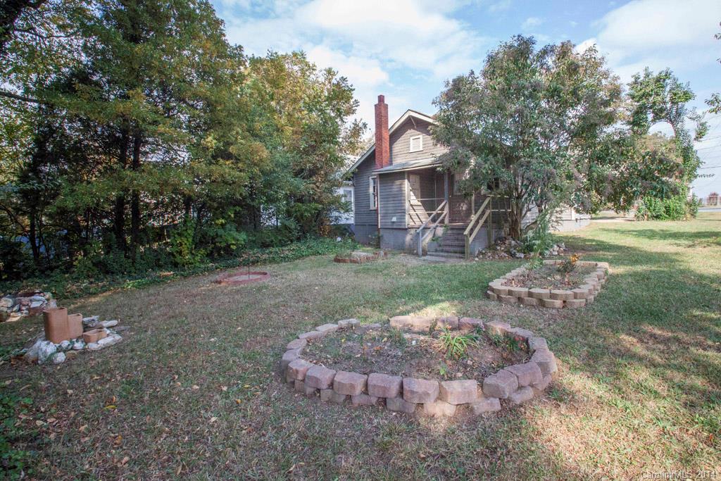 3101 Tuckaseegee Road Charlotte, NC 28208 - Photo 13 of 13 a view of a house with a yard