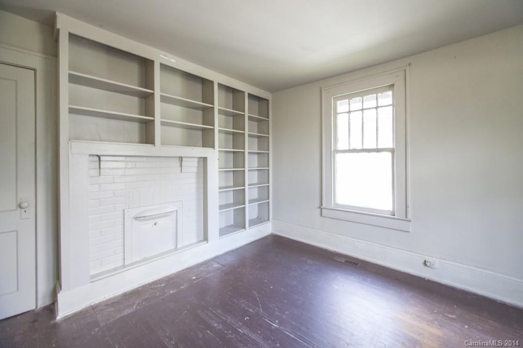 3101 Tuckaseegee Road Charlotte, NC 28208 - Photo 4 of 13 an empty room with windows and cabinet