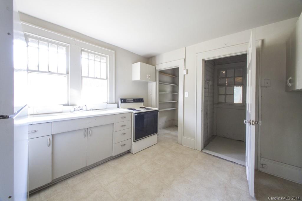3101 Tuckaseegee Road Charlotte, NC 28208 - Photo 5 of 13 a large white kitchen with a window and refrigerator