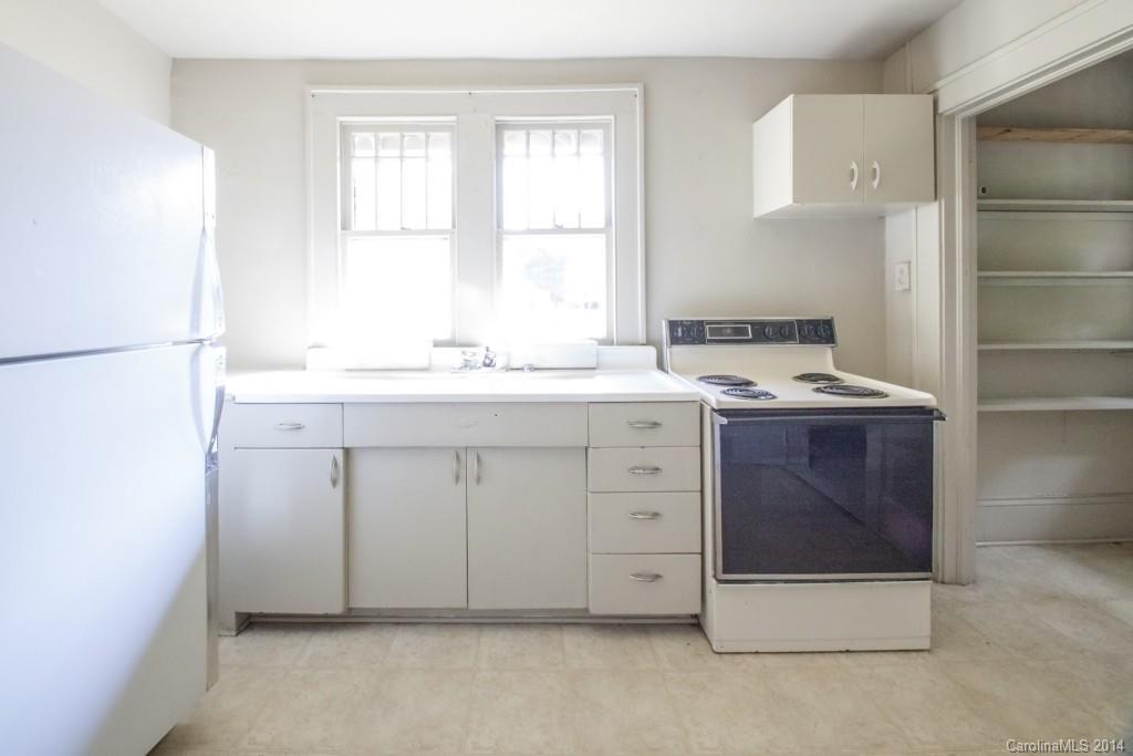 3101 Tuckaseegee Road Charlotte, NC 28208 - Photo 6 of 13 a utility room with a sink washer and dryer