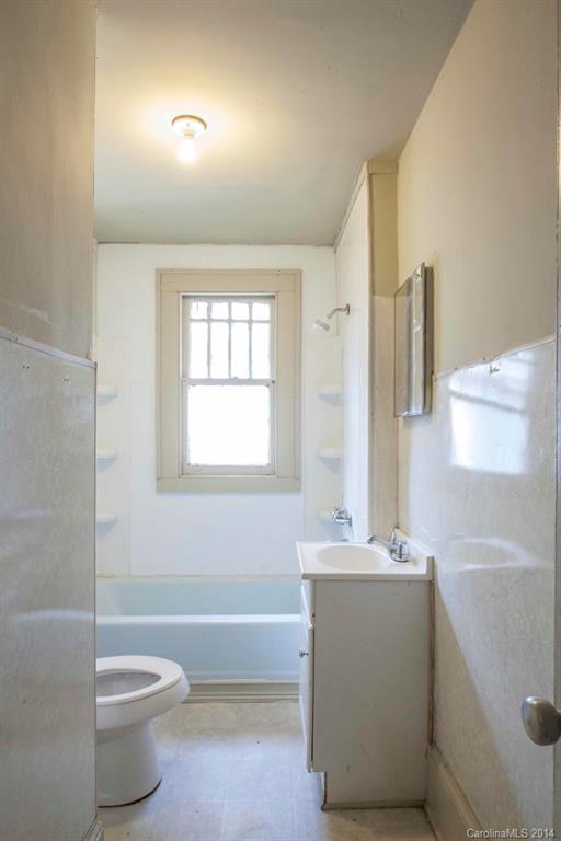 3101 Tuckaseegee Road Charlotte, NC 28208 - Photo 10 of 13 a bathroom with a bathtub sink and toilet