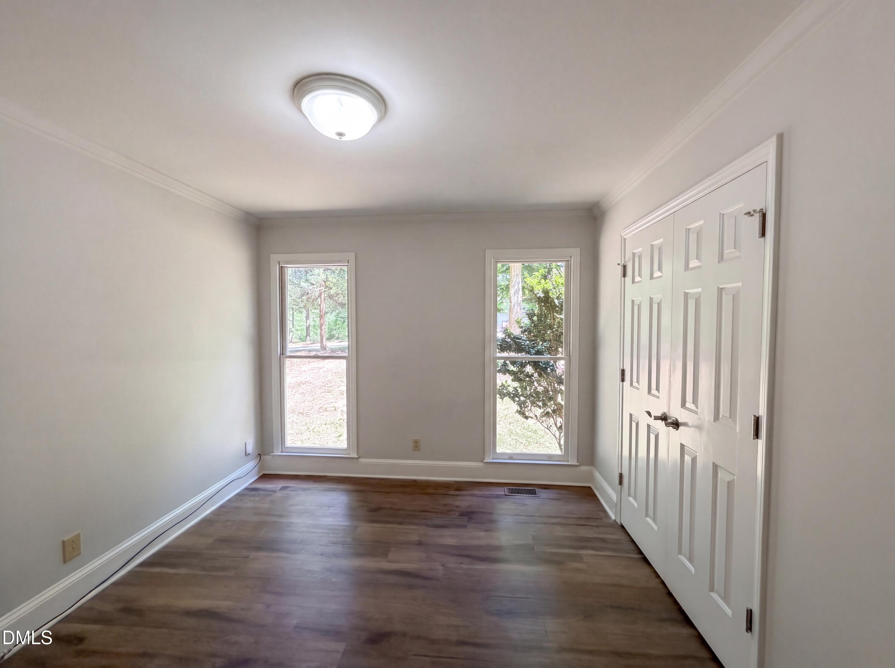 102 Lakeside Farm Road Zebulon, NC 27597 - Photo 14 of 18 wooden floor in an empty room with a window