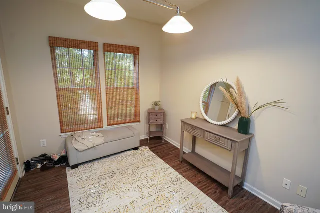 a living room with furniture a window and flowerpot