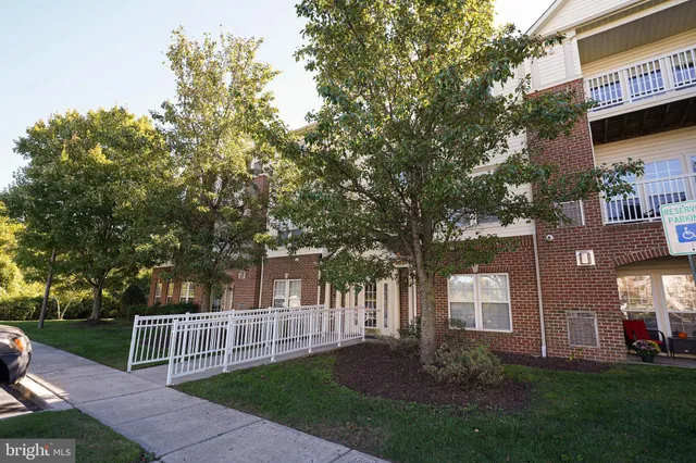 a view of house with a yard