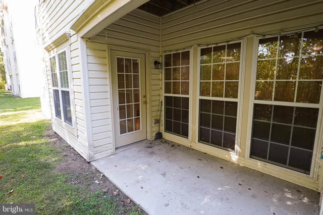 a view of empty room with windows