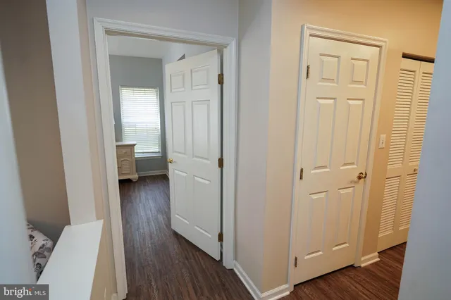 a view of a bathroom from a hallway