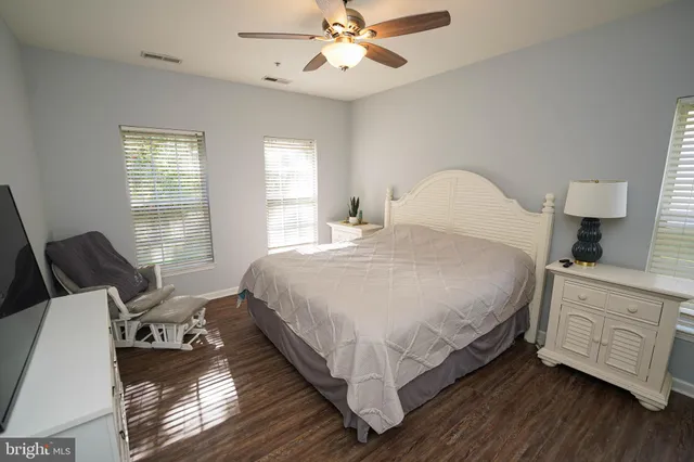 a bed room with a bed and a chandelier