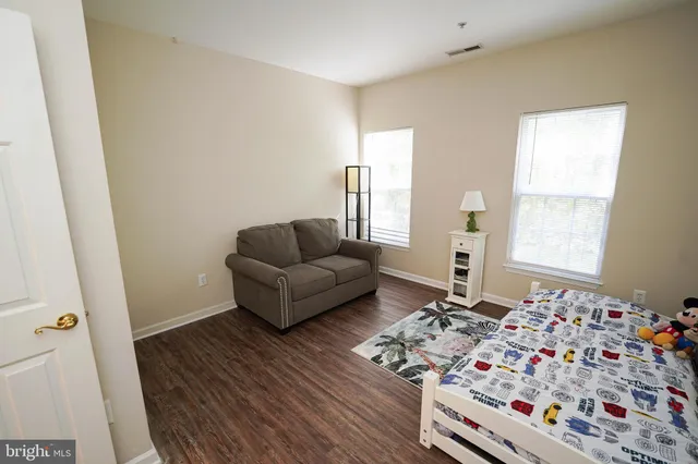 a living room with furniture and a gate
