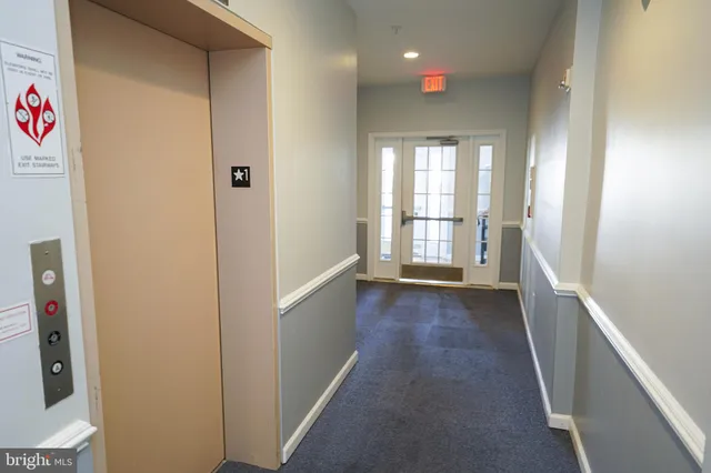 a view of hallway with a window
