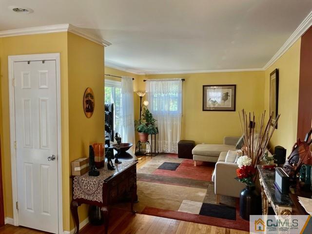 5 Bowser Road New Brunswick, NJ 08901 - Photo 19 of 45 a living room with furniture and a flat screen tv