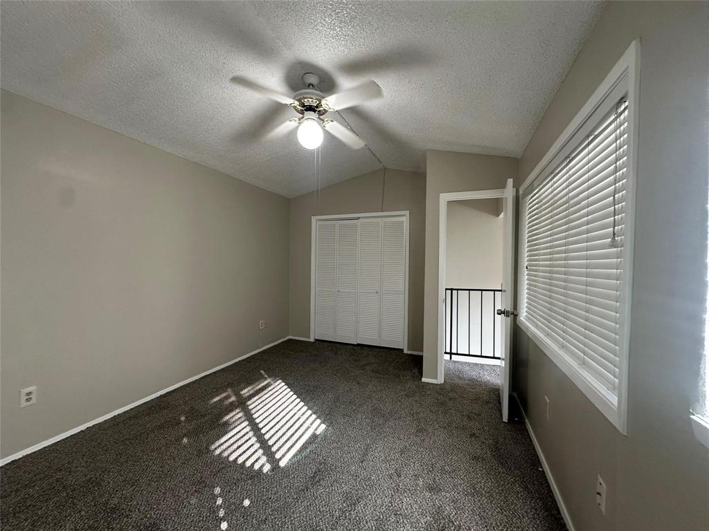 9696 Walnut Street, Unit 1107 Dallas, TX 75243 - Photo 11 of 13 a view of an empty room with a window