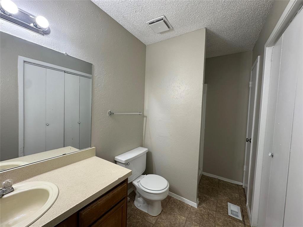 9696 Walnut Street, Unit 1107 Dallas, TX 75243 - Photo 10 of 13 a bathroom with a sink toilet and vanity
