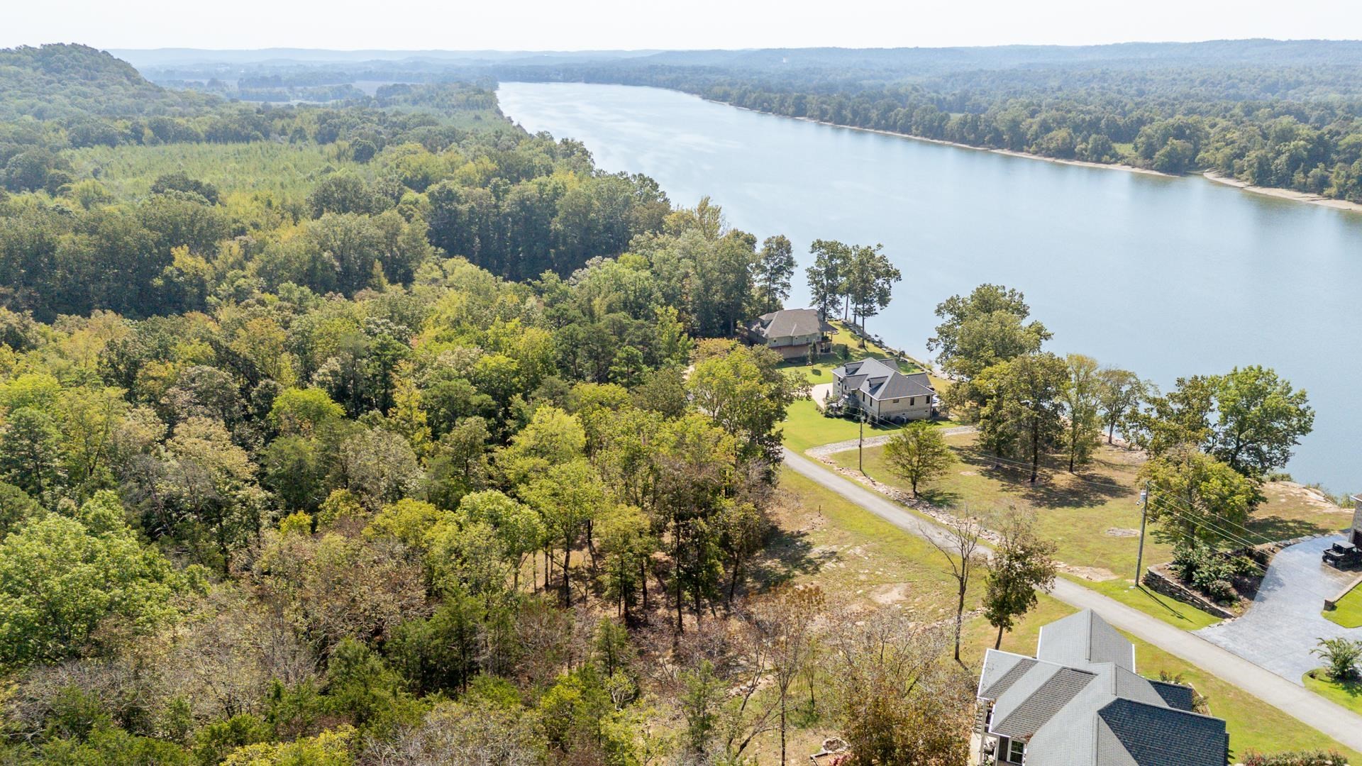 0 Mariah Lane Bath Springs, TN 38311 - Photo 21 of 38 a view of a lake with a mountain in the background