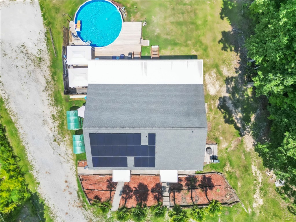 48 Tierra Drive Waterloo, SC 29384 - Photo 16 of 42 Solar panels line the roof of this property featuring an above-ground pool and spacious backyard.