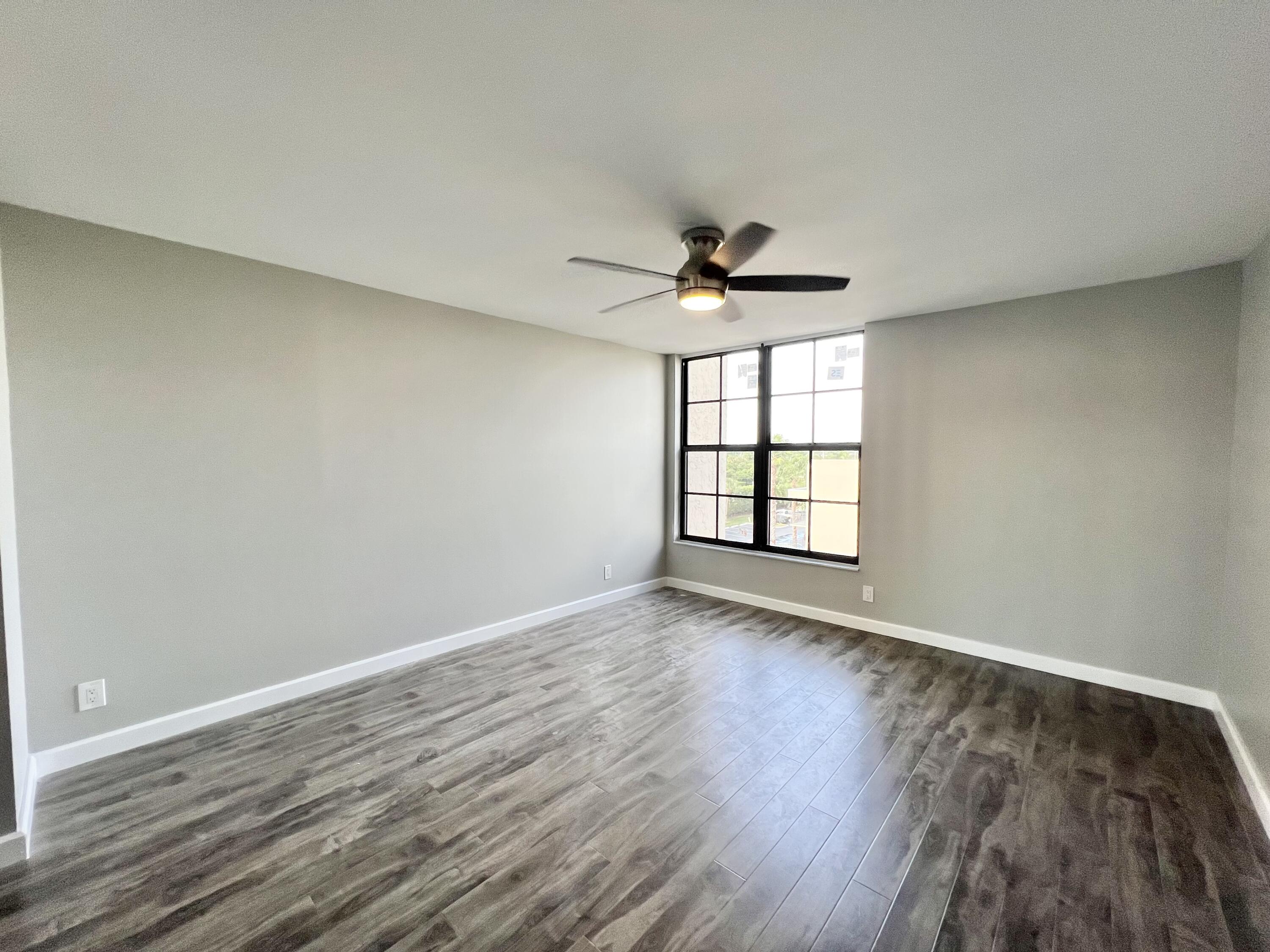 17 Royal Palm Way, Unit 503 Boca Raton, FL 33432 - Photo 11 of 29 wooden floor in an empty room with a window