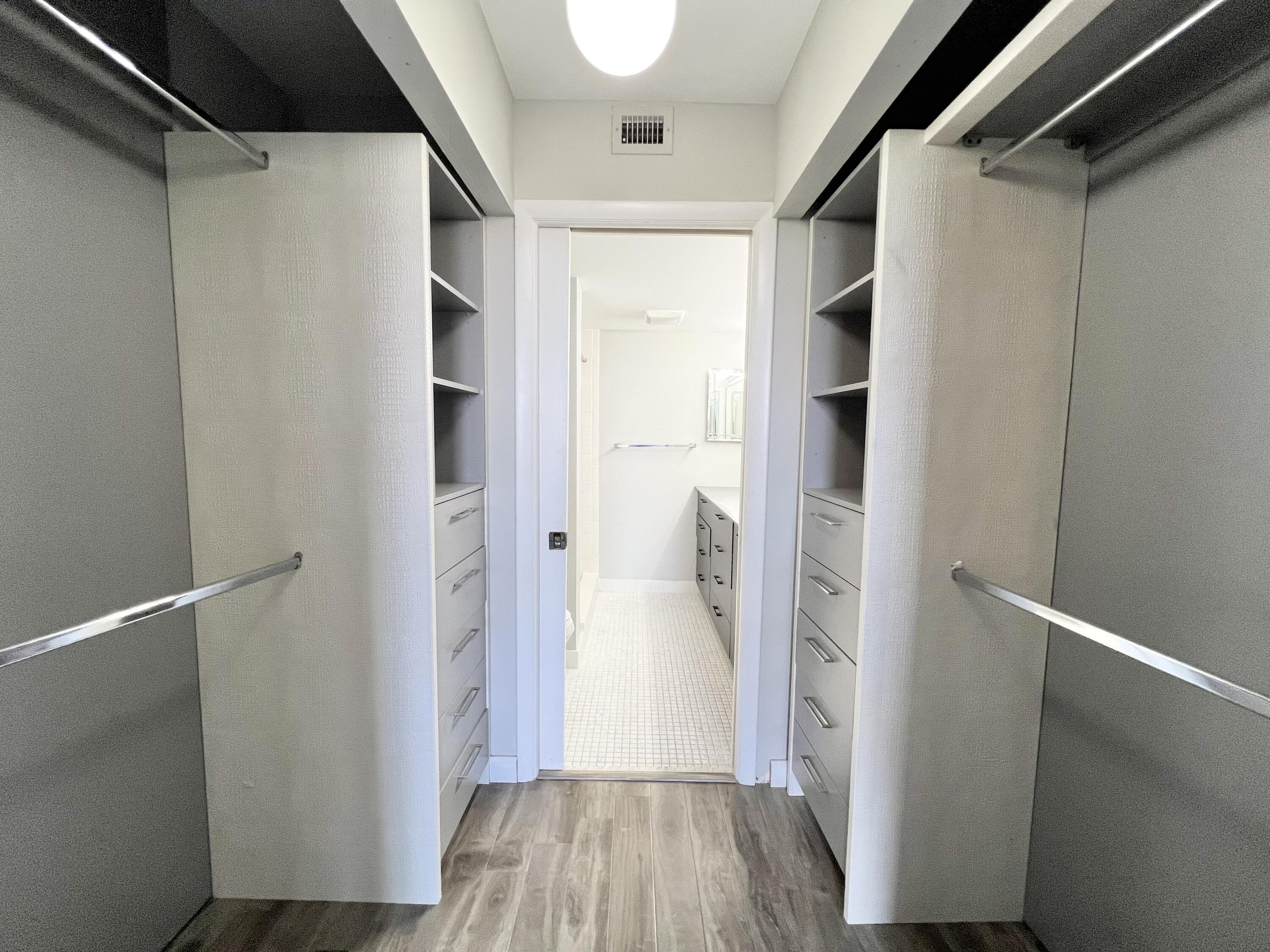 17 Royal Palm Way, Unit 503 Boca Raton, FL 33432 - Photo 12 of 29 a view of walk in closet with wooden floor