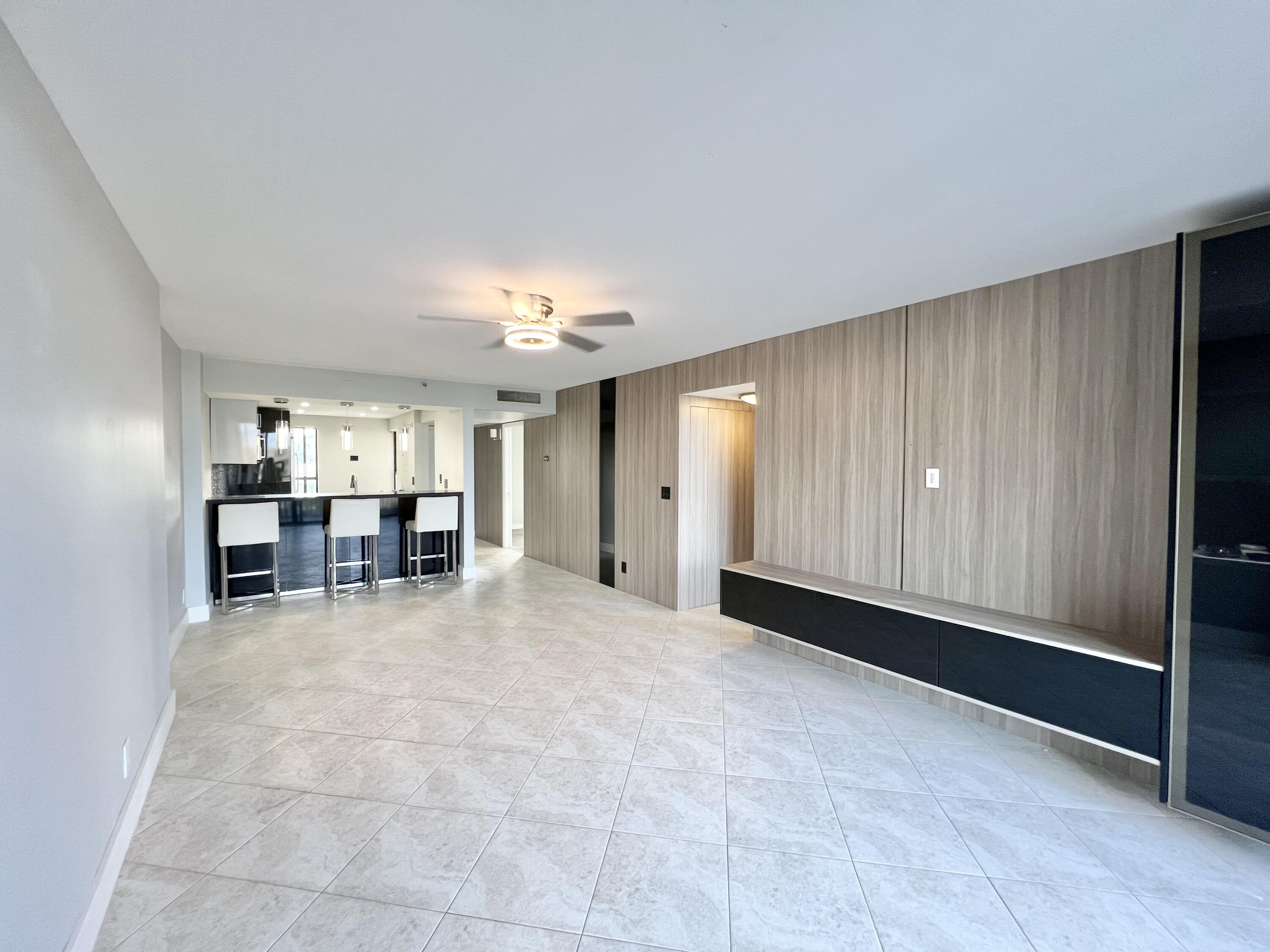 17 Royal Palm Way, Unit 503 Boca Raton, FL 33432 - Photo 6 of 29 a view of a room with cabinet and mirrors