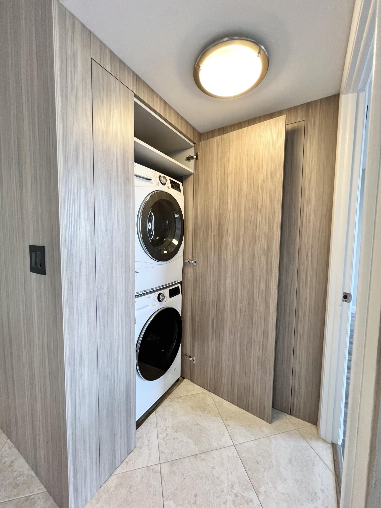 17 Royal Palm Way, Unit 503 Boca Raton, FL 33432 - Photo 9 of 29 a view of a hallway with washer and dryer