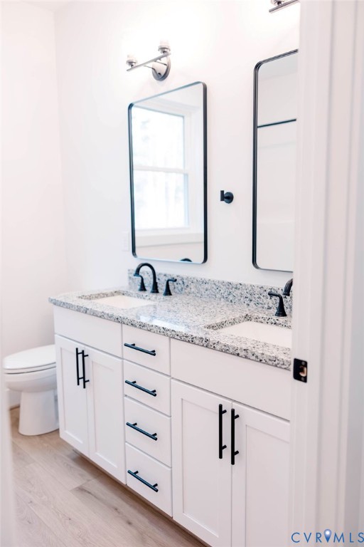 157 Barringer Lane Bumpass, VA 23024 - Photo 46 of 65 a bathroom with a granite countertop sink and a mirror