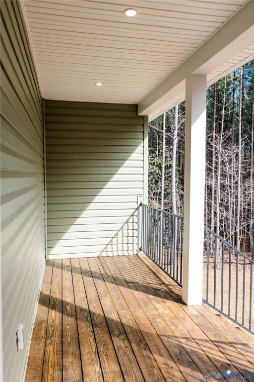 157 Barringer Lane Bumpass, VA 23024 - Photo 54 of 65 a view of a balcony with wooden floor