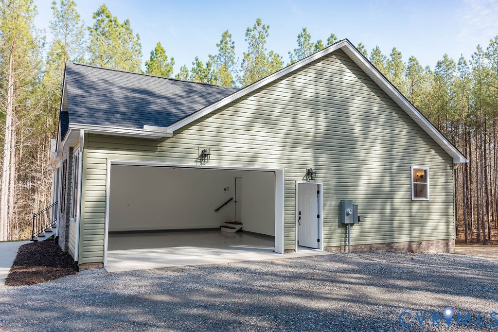 157 Barringer Lane Bumpass, VA 23024 - Photo 59 of 65 a view of a house with a garage