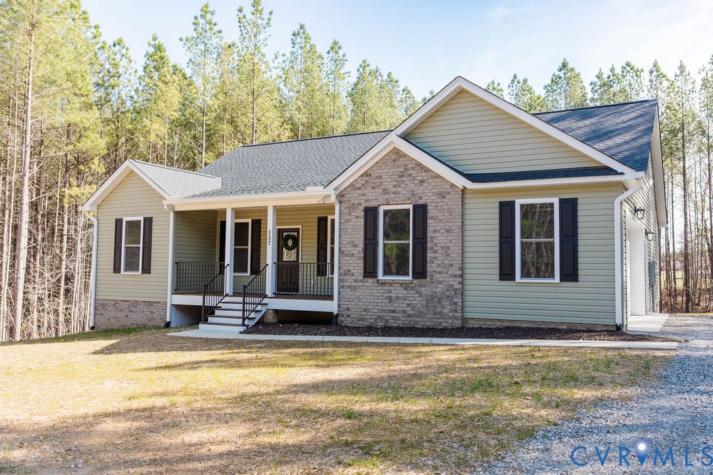 157 Barringer Lane Bumpass, VA 23024 - Photo 61 of 65 a front view of a house with a yard