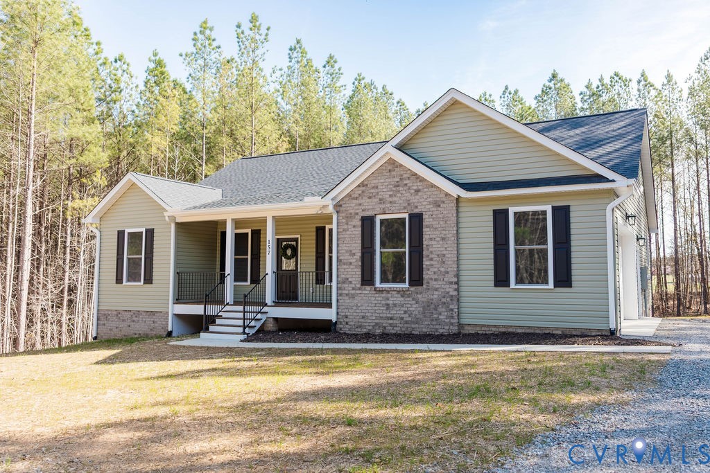 157 Barringer Lane Bumpass, VA 23024 - Photo 64 of 65 a front view of a house with swimming pool and porch