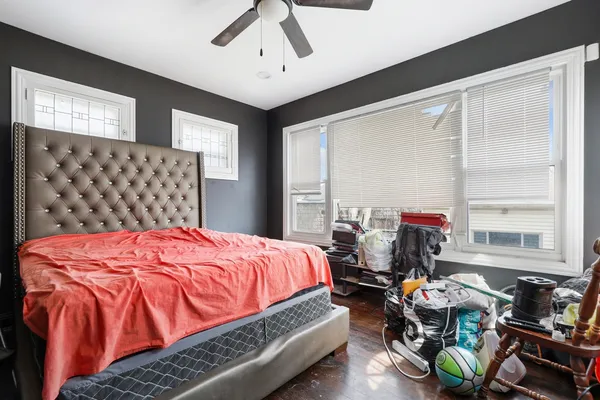 a bedroom with bed and a window