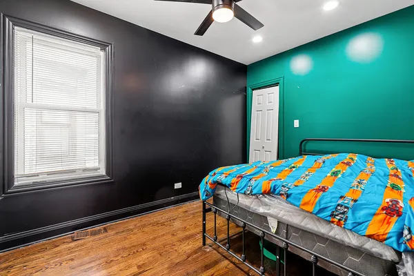 a bedroom with a bed and a window