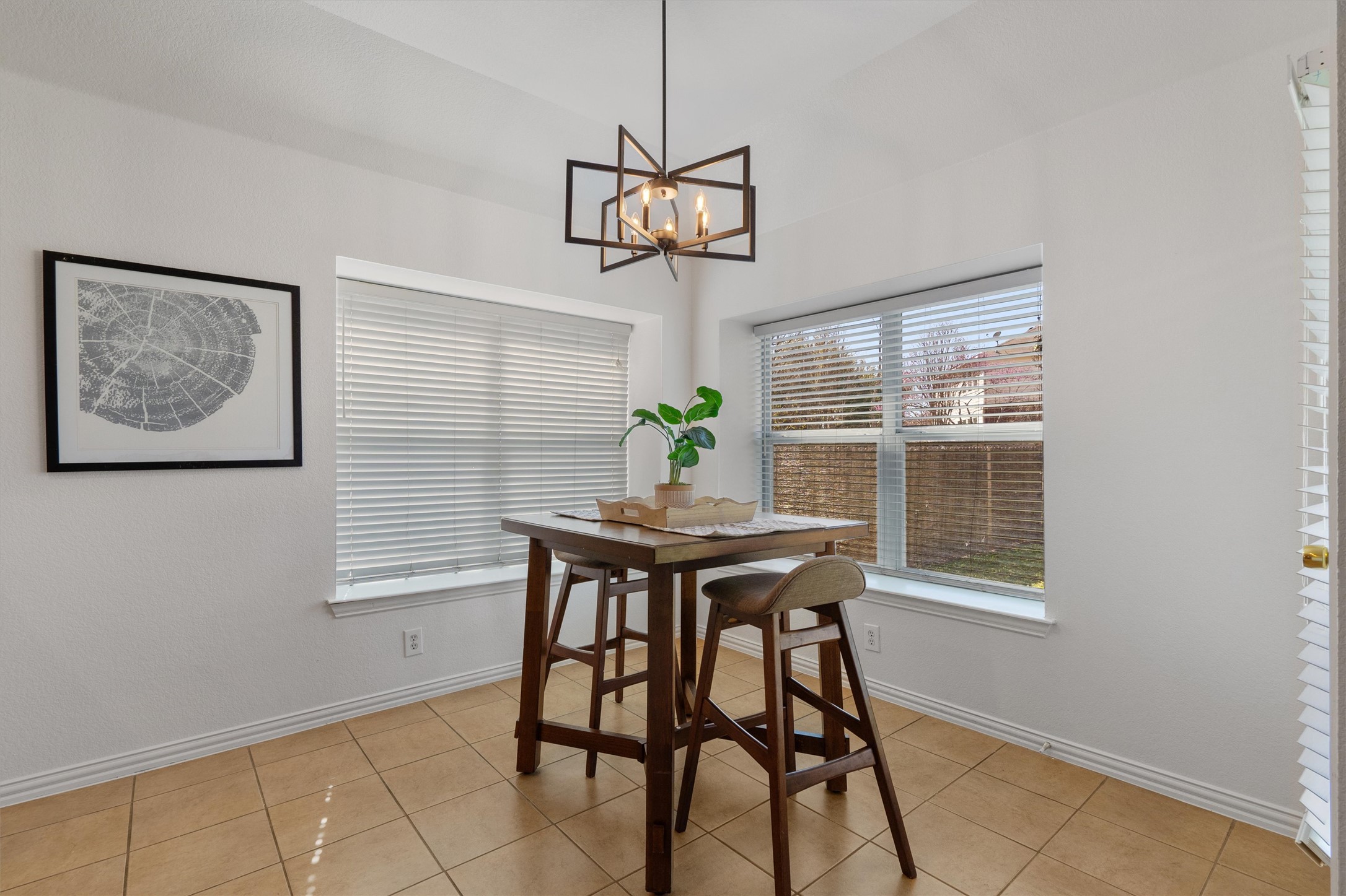 2801 Kickapoo Cavern Drive Pflugerville, TX 78660 - Photo 12 of 38 Dining area with light tile patterned floors and suspended lighting