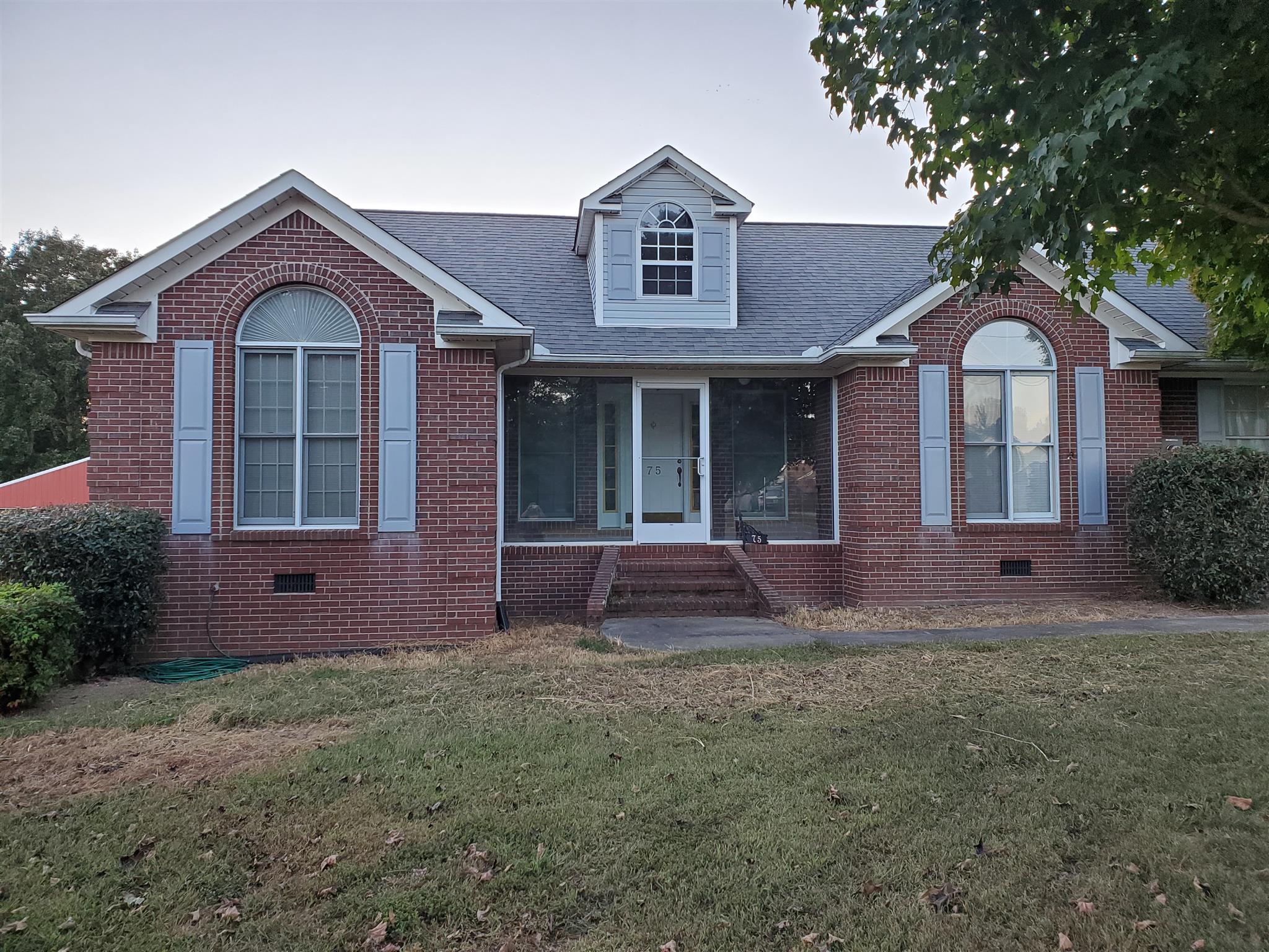 75 Eastridge Road Fayetteville, TN 37334 - Photo 3 of 25 a front view of a house with garden