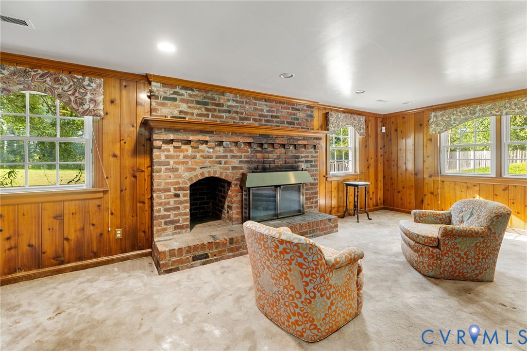 5212 Beddington Road Richmond, VA 23234 - Photo 14 of 22 a living room with furniture and a fireplace