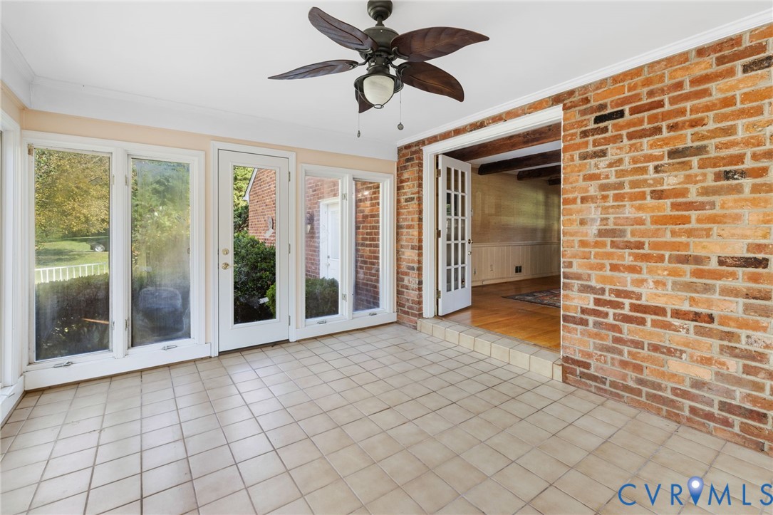 5212 Beddington Road Richmond, VA 23234 - Photo 16 of 22 a view of a livingroom with a chandelier fan and windows