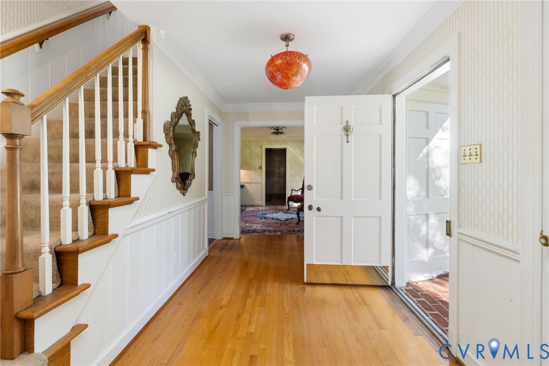 5212 Beddington Road Richmond, VA 23234 - Photo 4 of 22 a view of a hallway with wooden floor and staircase