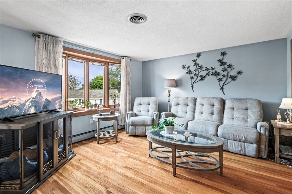 30 Lanark Road Malden, MA 02148 - Photo 11 of 40 a living room with furniture and a fireplace