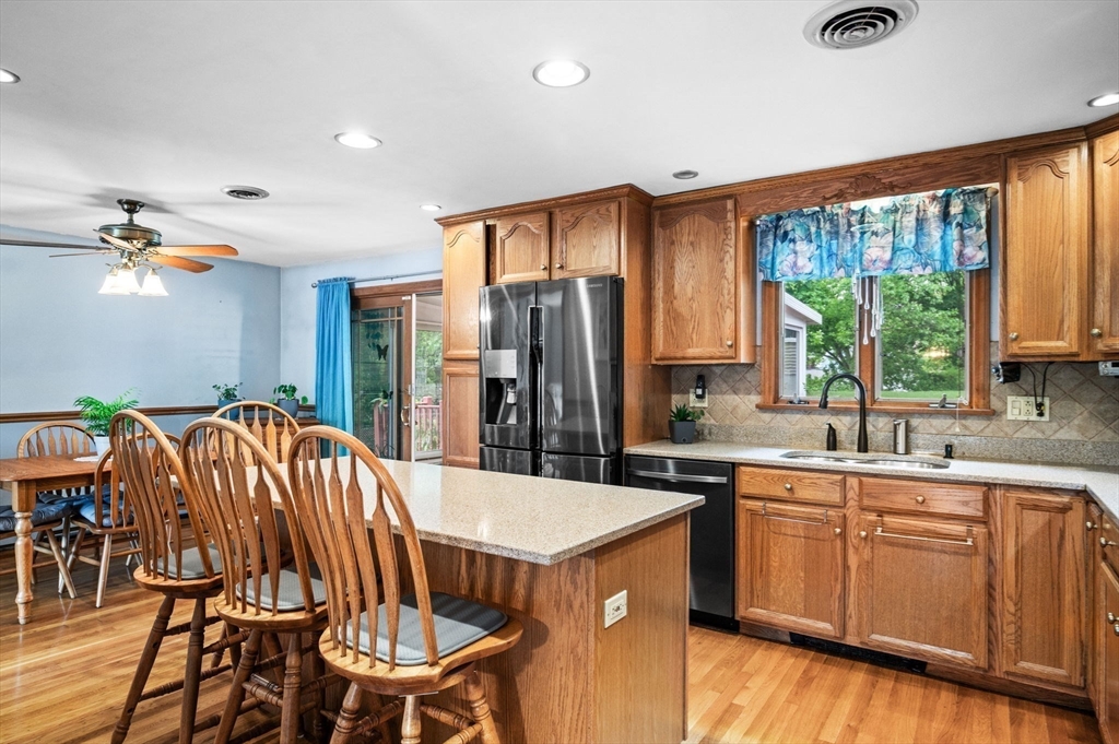 30 Lanark Road Malden, MA 02148 - Photo 19 of 40 a kitchen that has a sink a window and stainless steel appliances