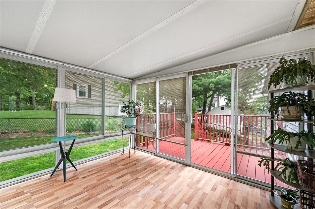 30 Lanark Road Malden, MA 02148 - Photo 22 of 40 a view of a porch with wooden floor and floor to ceiling window