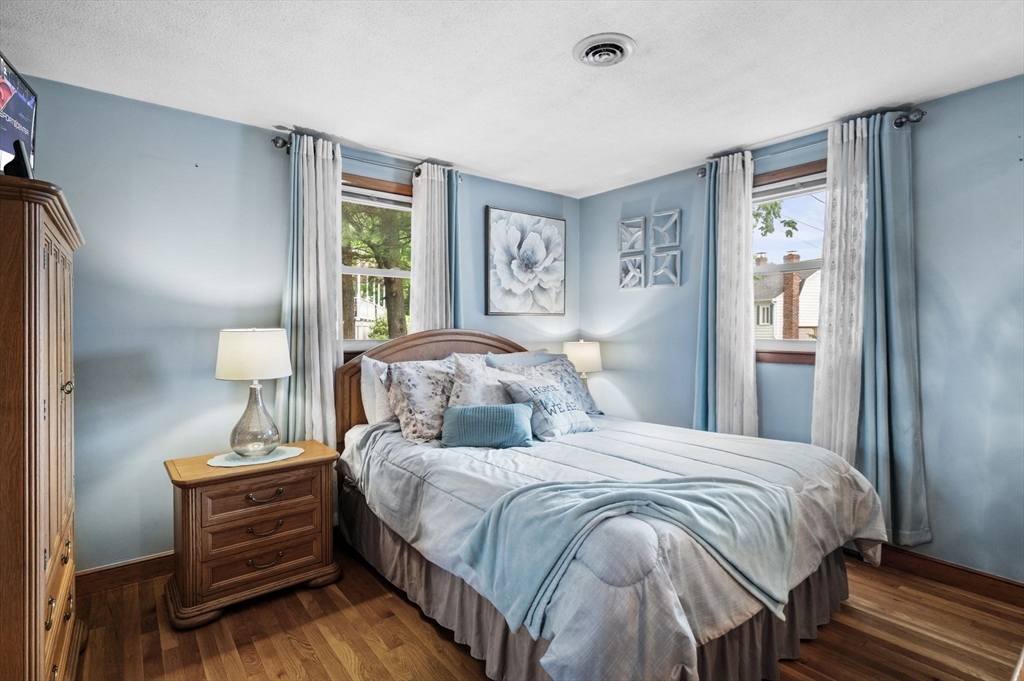 30 Lanark Road Malden, MA 02148 - Photo 25 of 40 a bedroom with a bed and a table