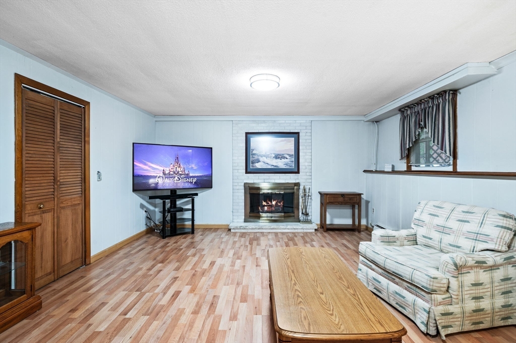 30 Lanark Road Malden, MA 02148 - Photo 28 of 40 a view of a livingroom with furniture a flat screen tv and couches