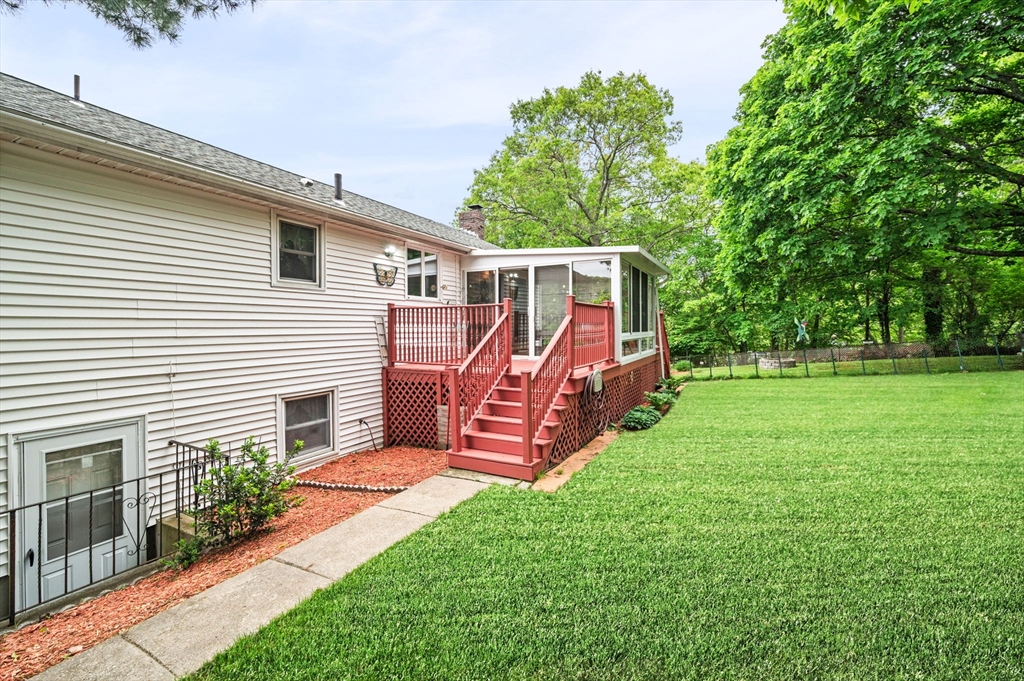 30 Lanark Road Malden, MA 02148 - Photo 5 of 40 a view of a house with a yard and furniture