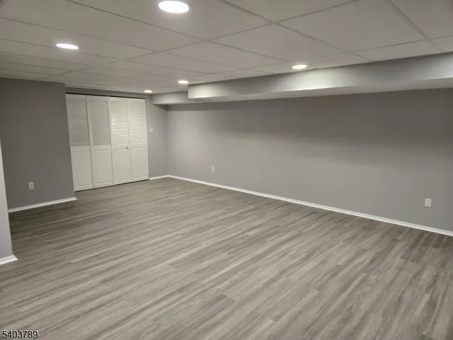 an empty room with wooden floor