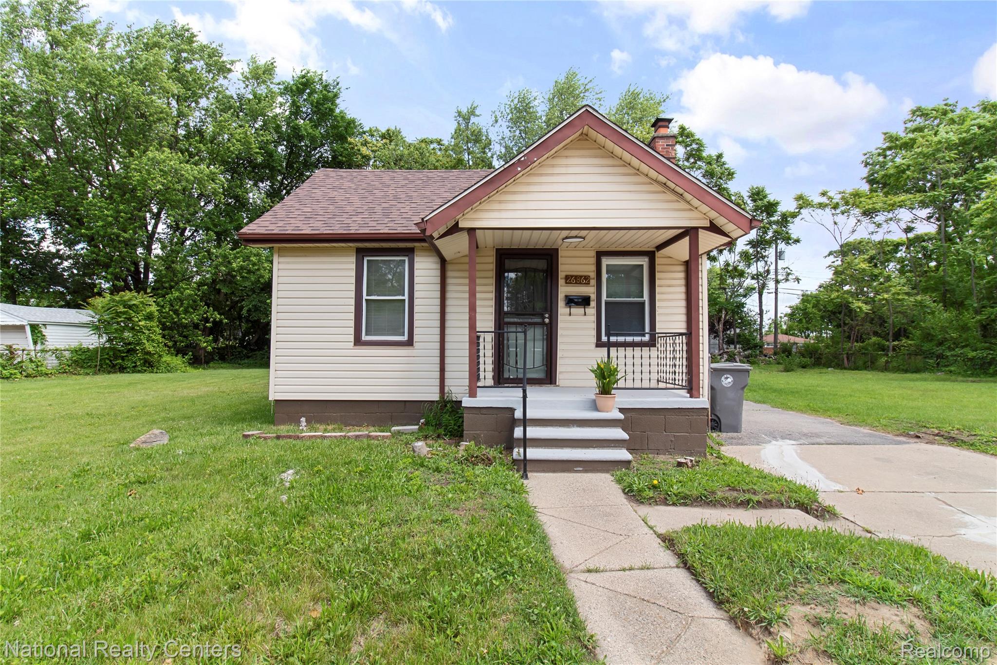 26862 Yale Street Inkster, MI 48141 - Photo 1 of 34 Single-story residence featuring light-colored siding with dark trim accents